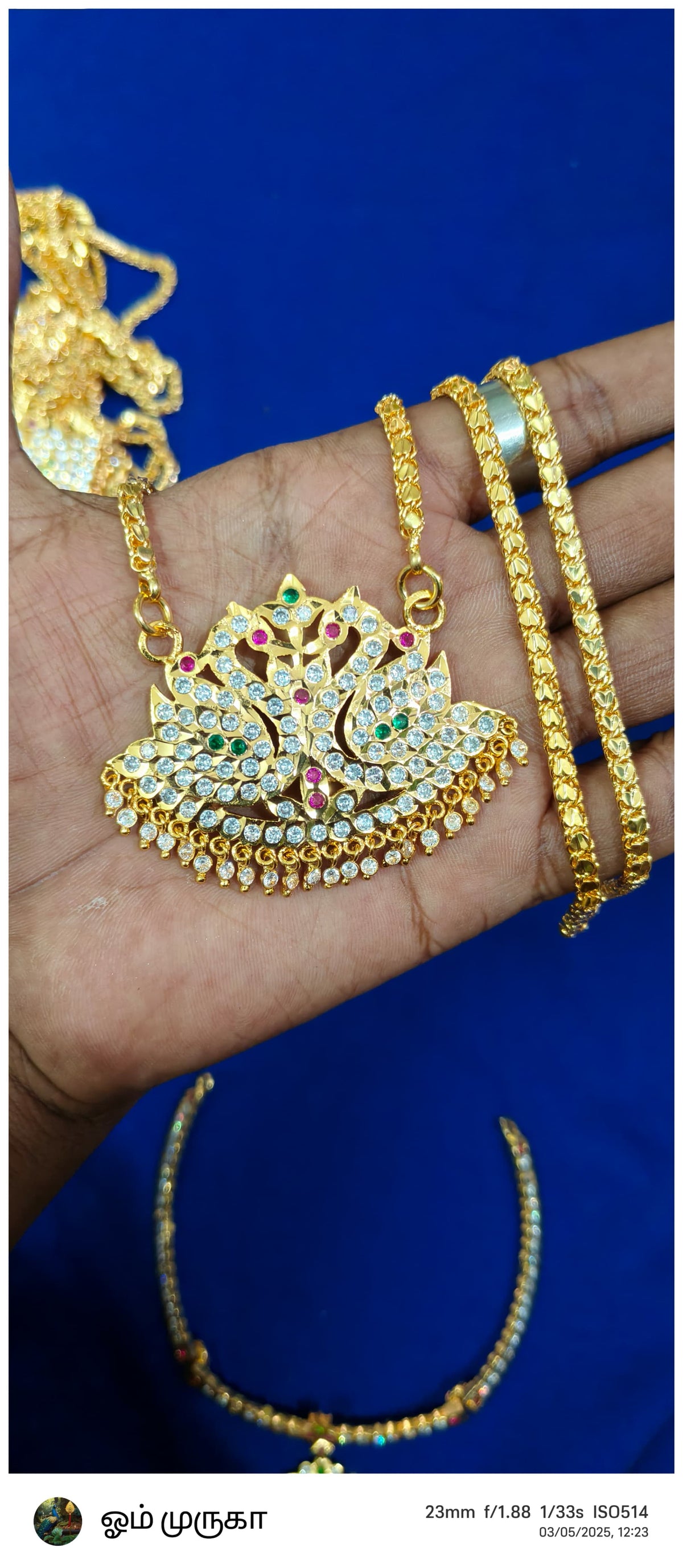 AN IMPON DOLLAR CHAIN,A GOLD - PLATED FINISH AND A PENDANT ADORNED WITH MULTIPLE STONES WITH BEST QUALITY